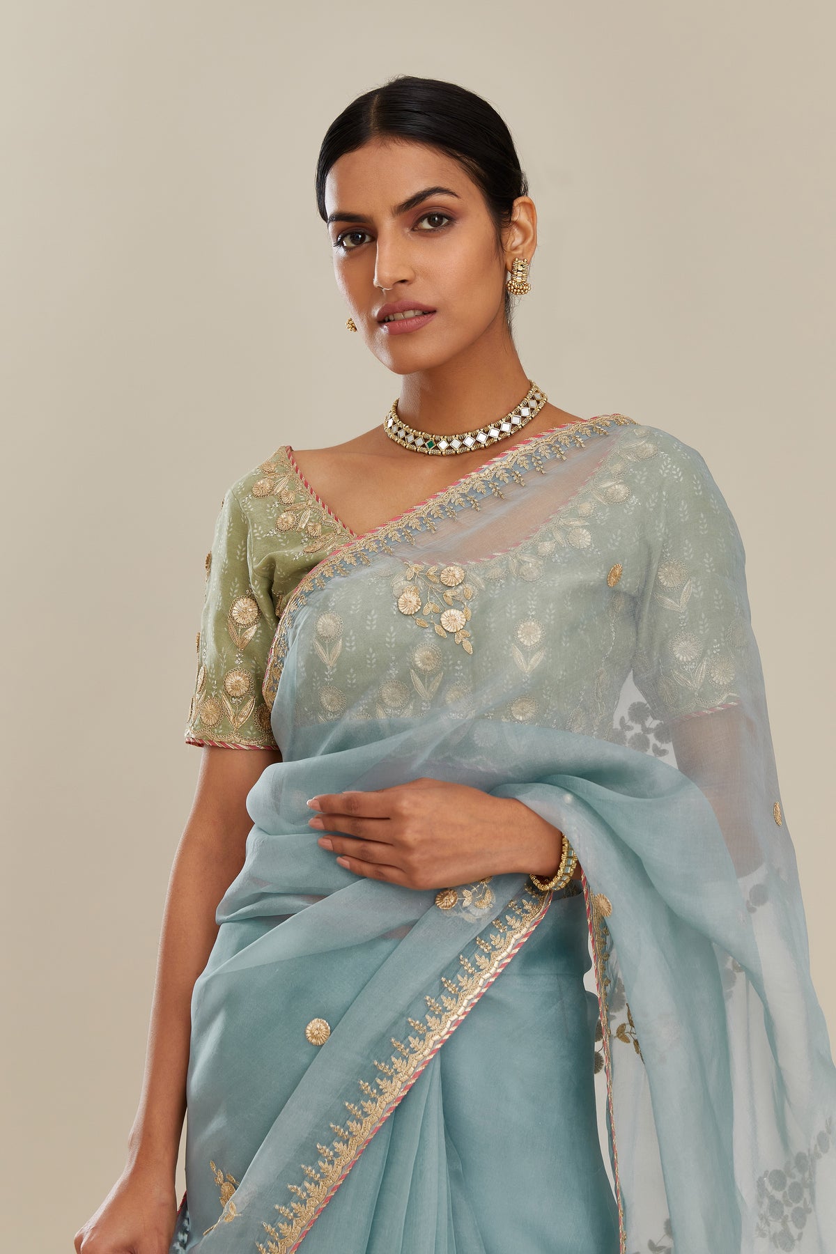Sage green hand block printed silk chanderi blouse with all-over gold gota and zari embroidery. (Blouse)