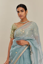 Blue silk organza saree with delicate gold gota and zari embroidery border. and blouse