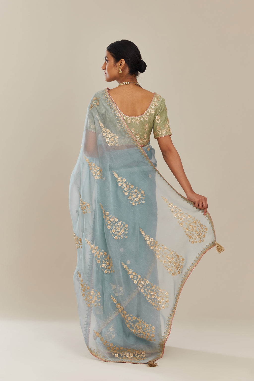 Blue silk organza saree with delicate gold gota and zari embroidery border. and blouse