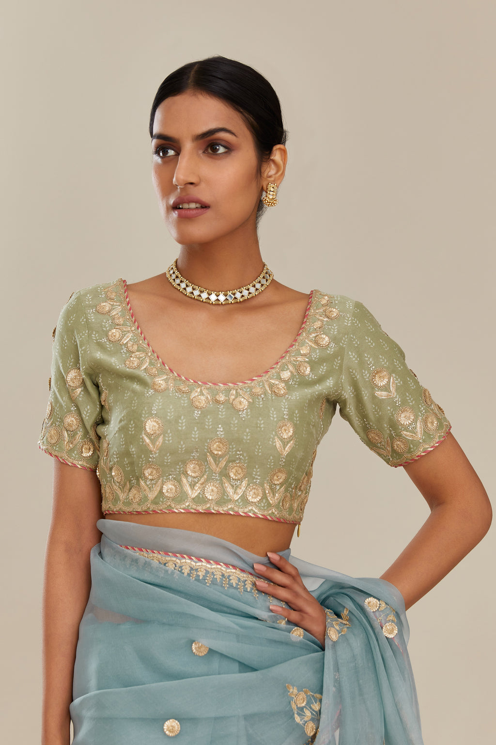 Sage green hand block printed silk chanderi blouse with all-over gold gota and zari embroidery. (Blouse)