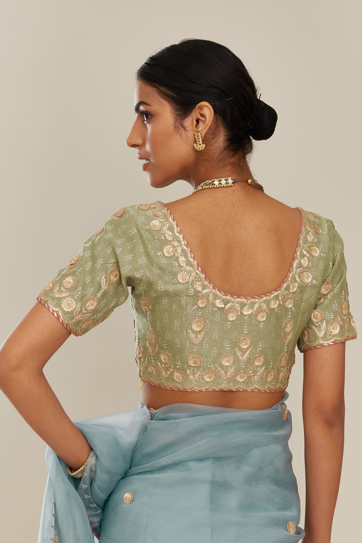 Sage green hand block printed silk chanderi blouse with all-over gold gota and zari embroidery. (Blouse)