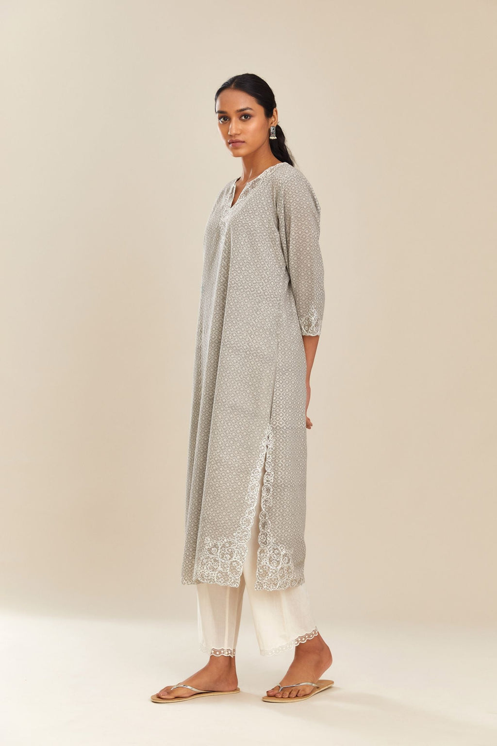 Grey hand block over-printed cotton straight kurta set with embroidered cotton chanderi cutwork side panels, highlighted with sequins.