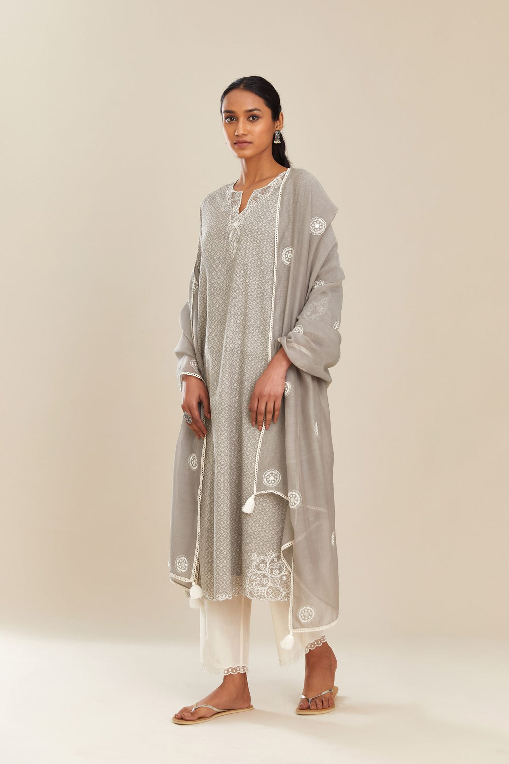Grey hand block over-printed cotton straight kurta set with embroidered cotton chanderi cutwork side panels, highlighted with sequins.