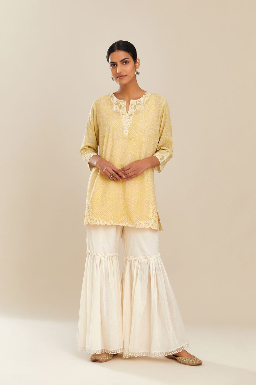 Yellow hand block over-printed cotton straight short kurta set with embroidered cotton chanderi cutwork, highlighted with sequins.