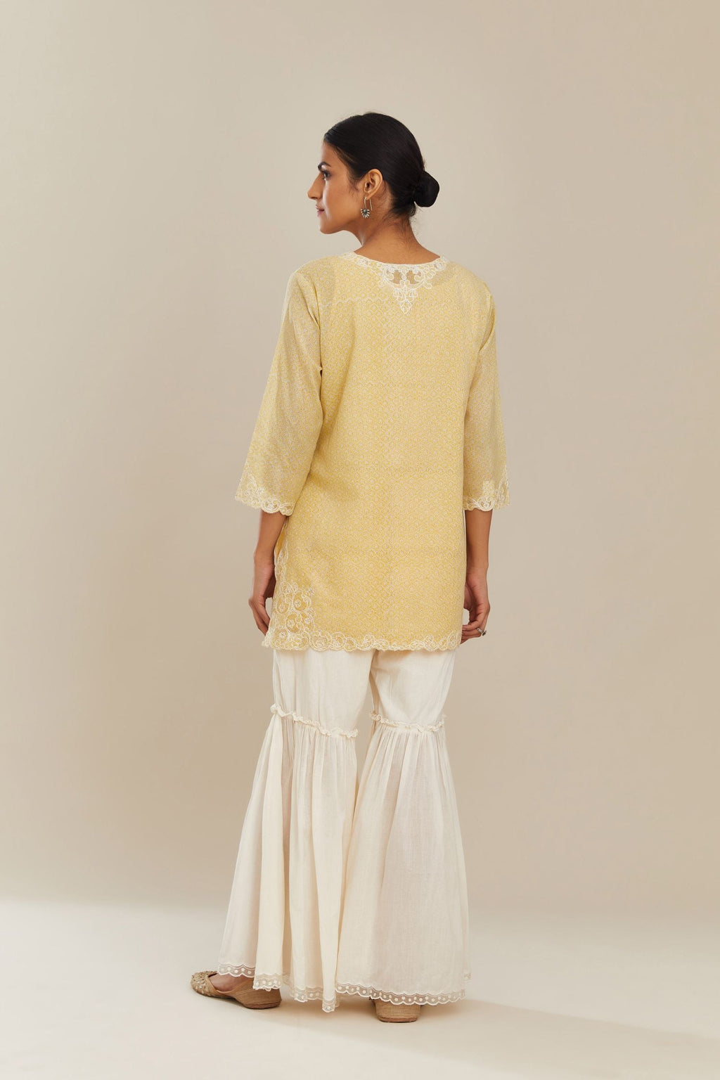 Yellow hand block over-printed cotton straight short kurta set with embroidered cotton chanderi cutwork, highlighted with sequins.