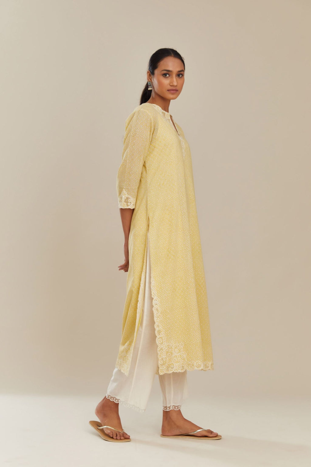 Yellow hand block over-printed cotton straight kurta set with embroidered cotton chanderi cutwork side panels, highlighted with sequins