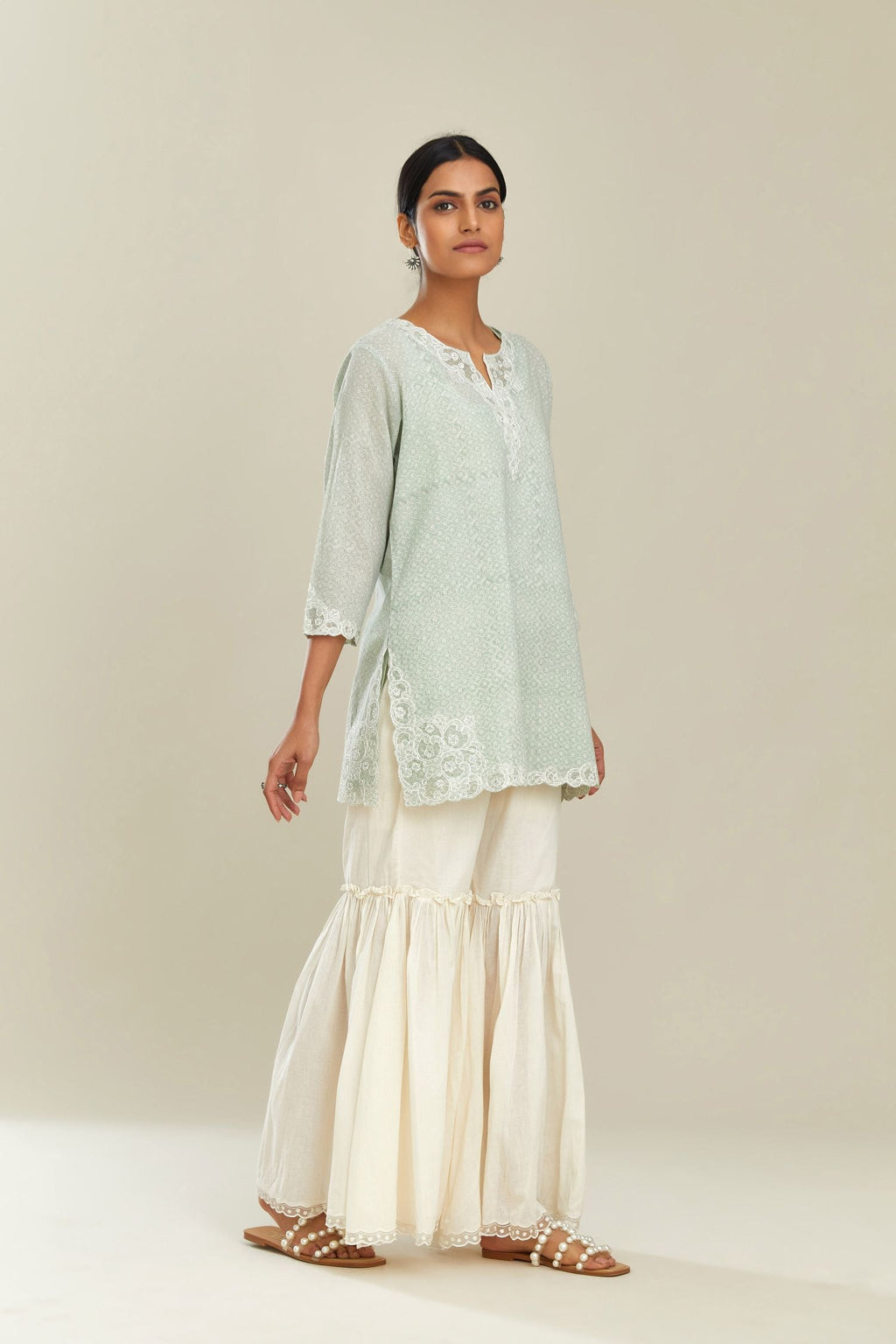 Green hand block over-printed cotton straight short kurta set with embroidered cotton chanderi cutwork, highlighted with sequins.