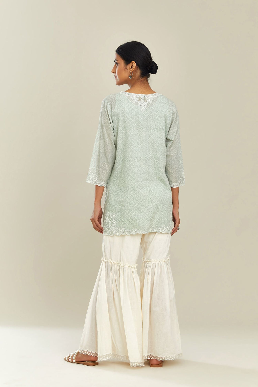 Green hand block over-printed cotton straight short kurta set with embroidered cotton chanderi cutwork, highlighted with sequins.