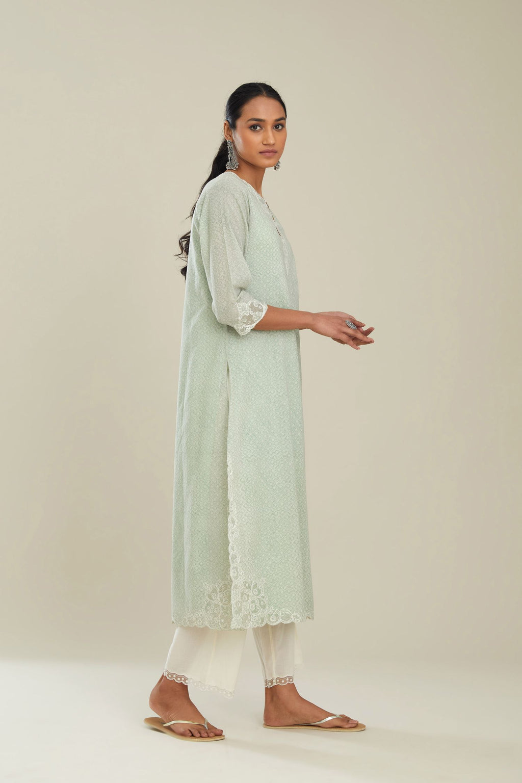Green hand block over-printed cotton straight kurta set with embroidered cotton chanderi cutwork side panels, highlighted with sequins