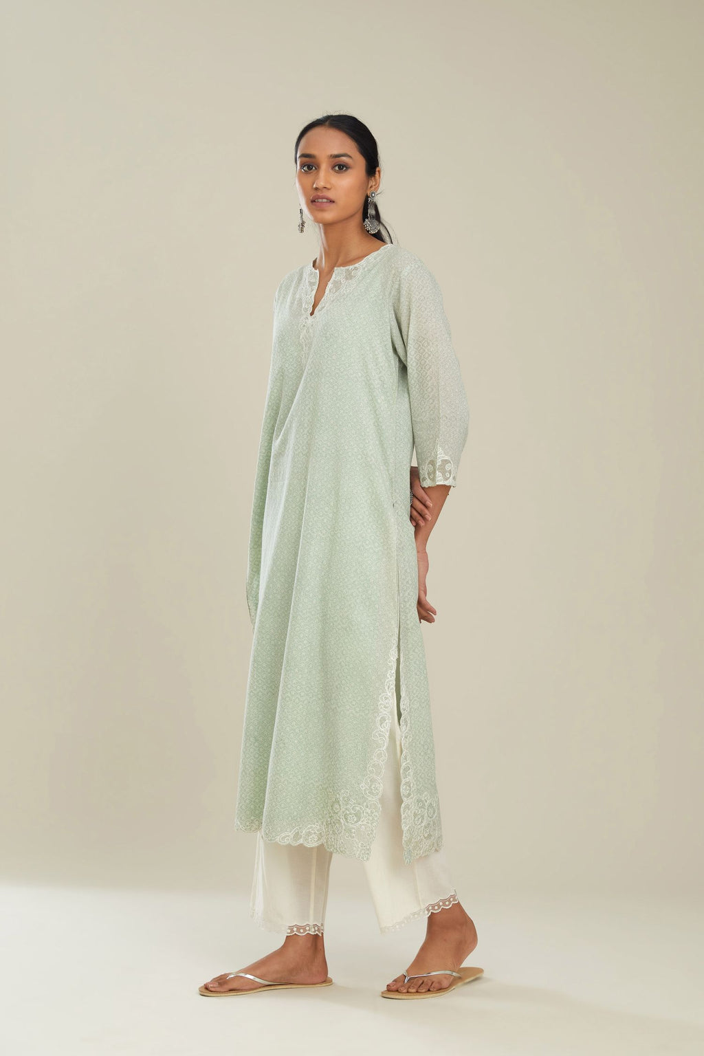 Green hand block over-printed cotton straight kurta set with embroidered cotton chanderi cutwork side panels, highlighted with sequins