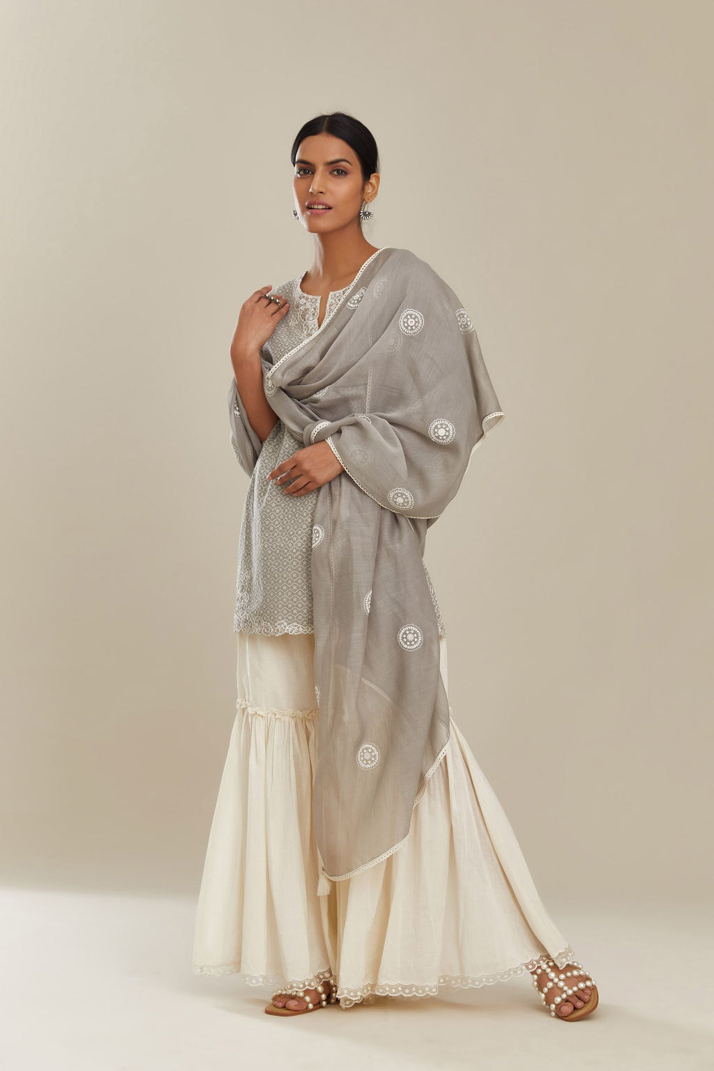 Grey cotton chanderi dupatta with all over round booti embroidery.