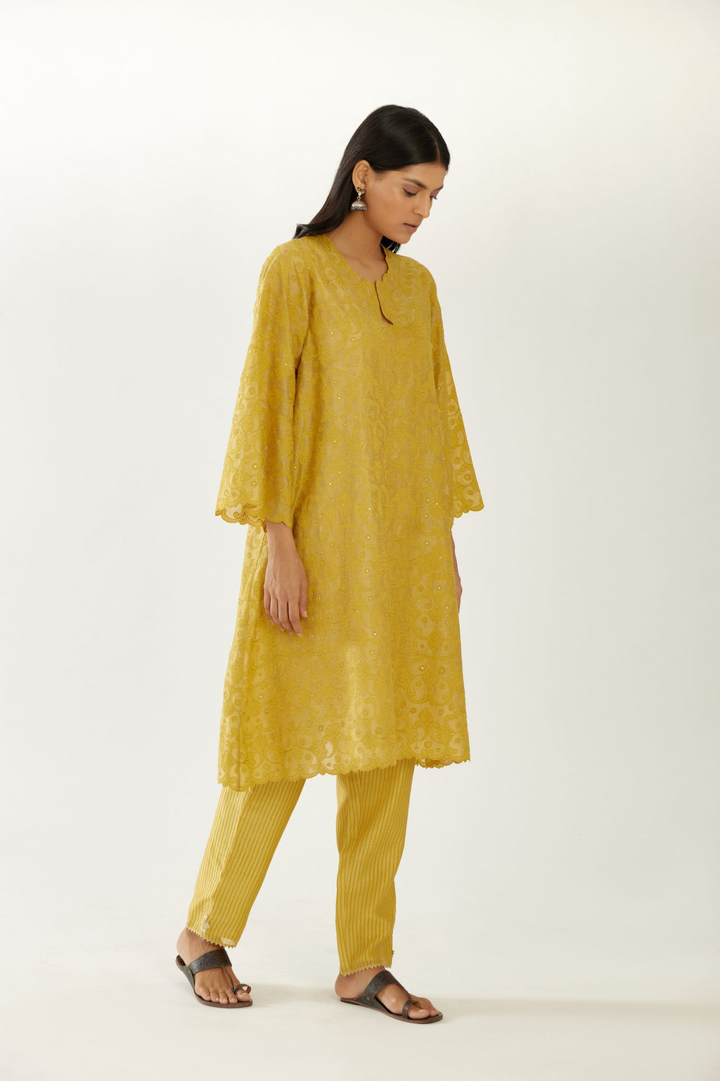 Yellow short easy fit kurta set with all-over trellis jaal appliqué, highlighted with sequins.