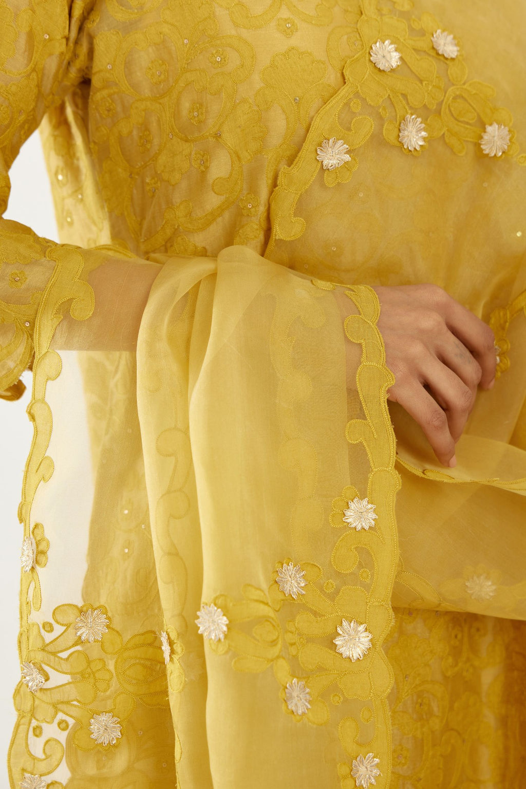 Yellow organza dupatta with heavy silk chanderi appliqué embroidery and gota flower detail.