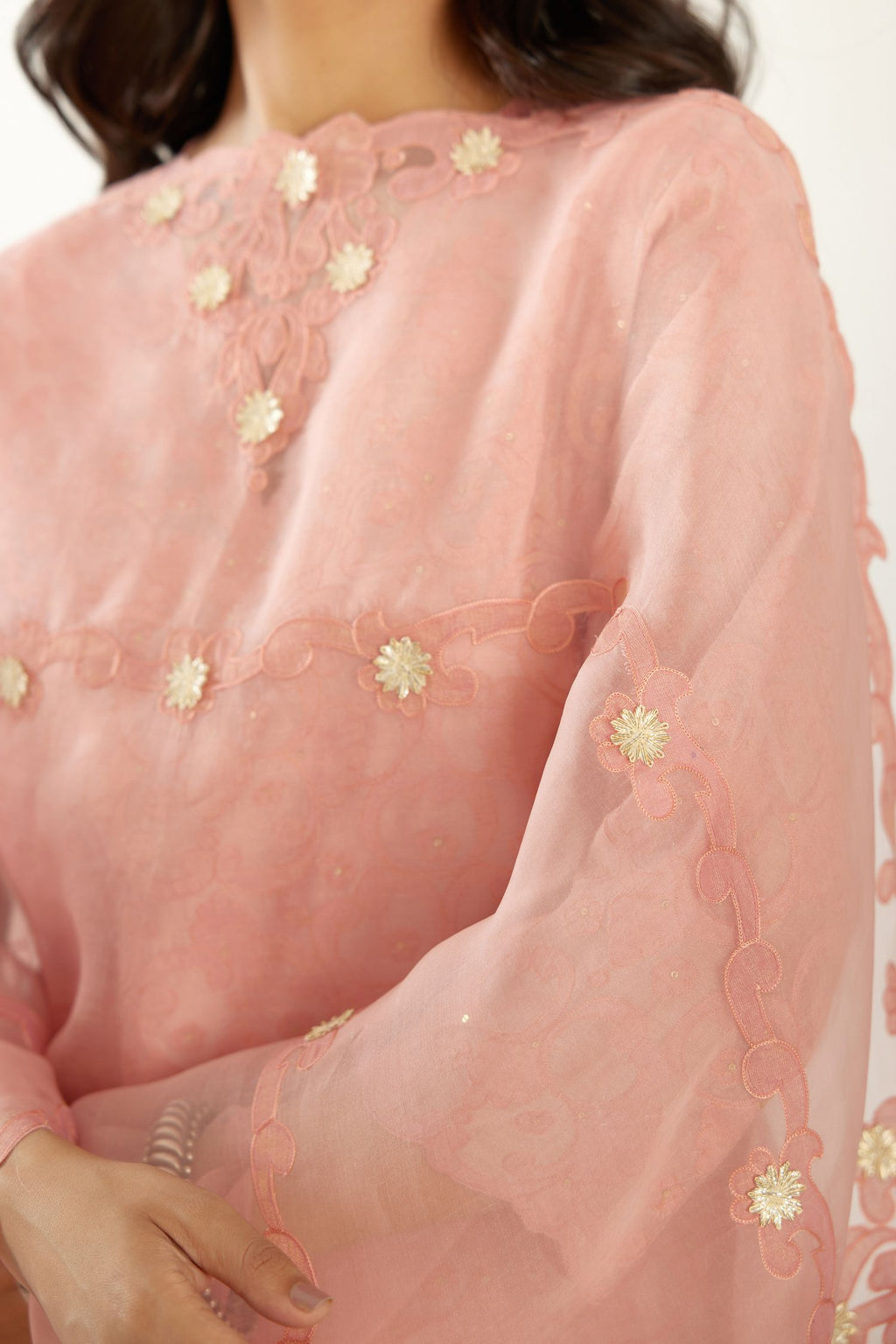 Pink organza dupatta with heavy silk chanderi appliqué embroidery and gota flower detail.