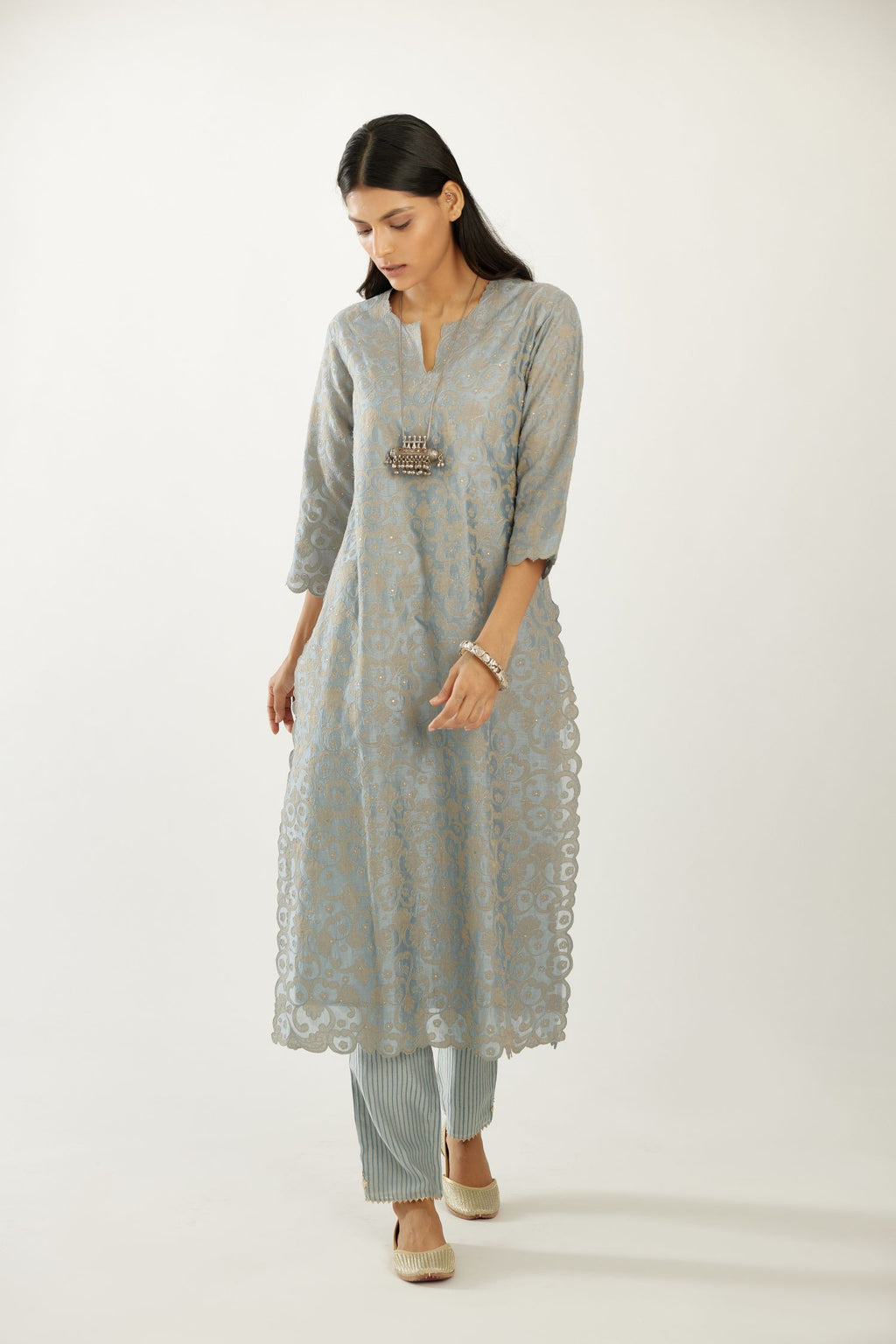 Silk chanderi straight kurta set with all-over tissue chanderi appliqué trellis jaal, highlighted with sequins.
