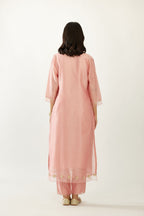 Pink silk chanderi hand block printed straight kurta set, highlighted with organza and gota embroidered flower at edges