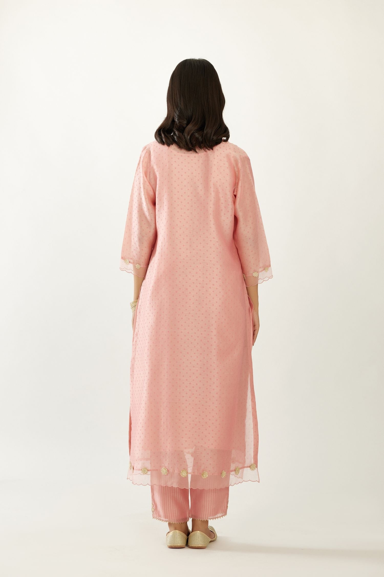 Pink silk chanderi hand block printed straight kurta set, highlighted with organza and gota embroidered flower at edges