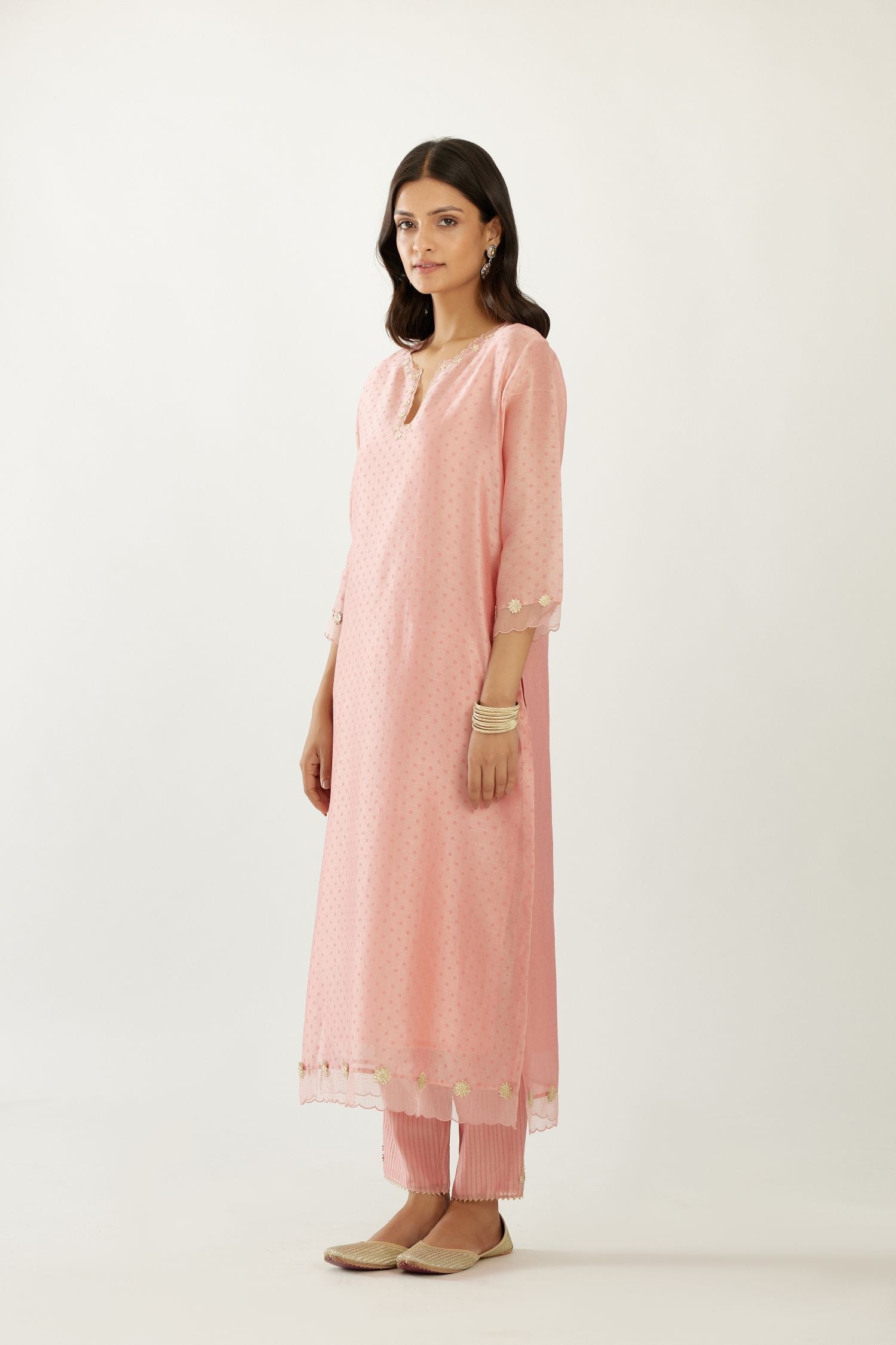Pink silk chanderi hand block printed straight kurta set, highlighted with organza and gota embroidered flower at edges