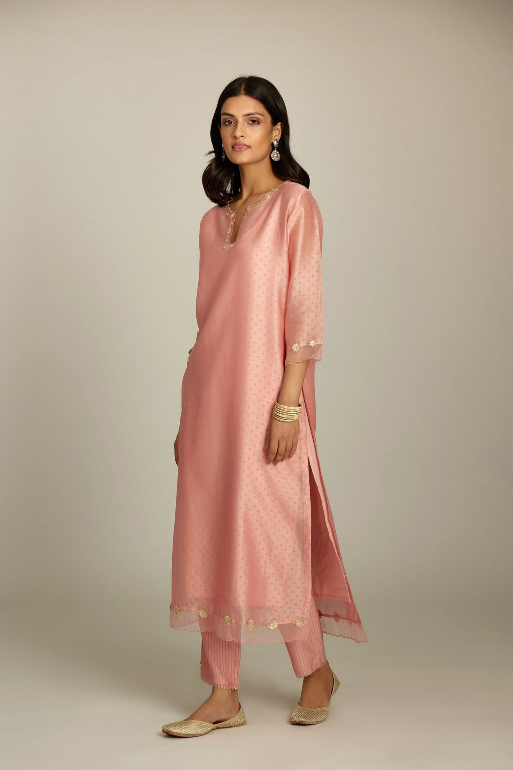 Pink silk chanderi hand block printed straight kurta set, highlighted with organza and gota embroidered flower at edges
