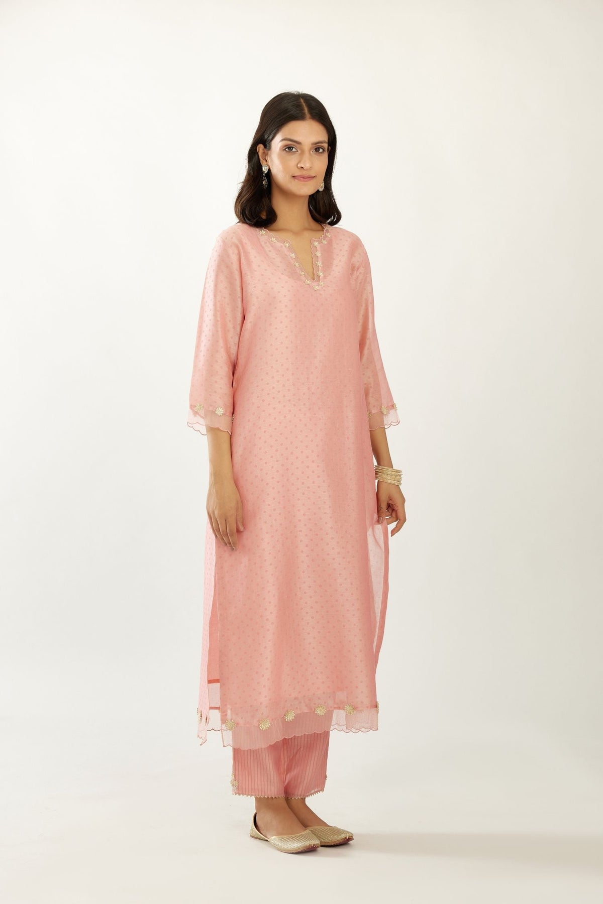 Pink silk chanderi hand block printed straight kurta set, highlighted with organza and gota embroidered flower at edges