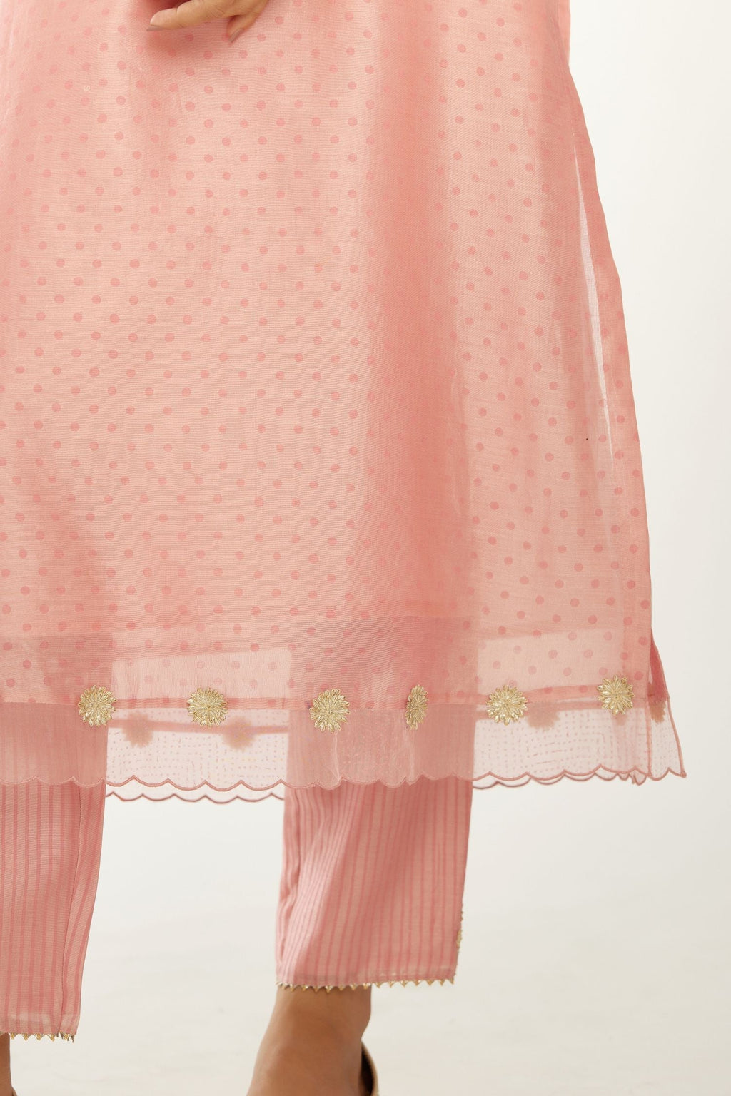Pink silk chanderi hand block printed straight kurta set, highlighted with organza and gota embroidered flower at edges