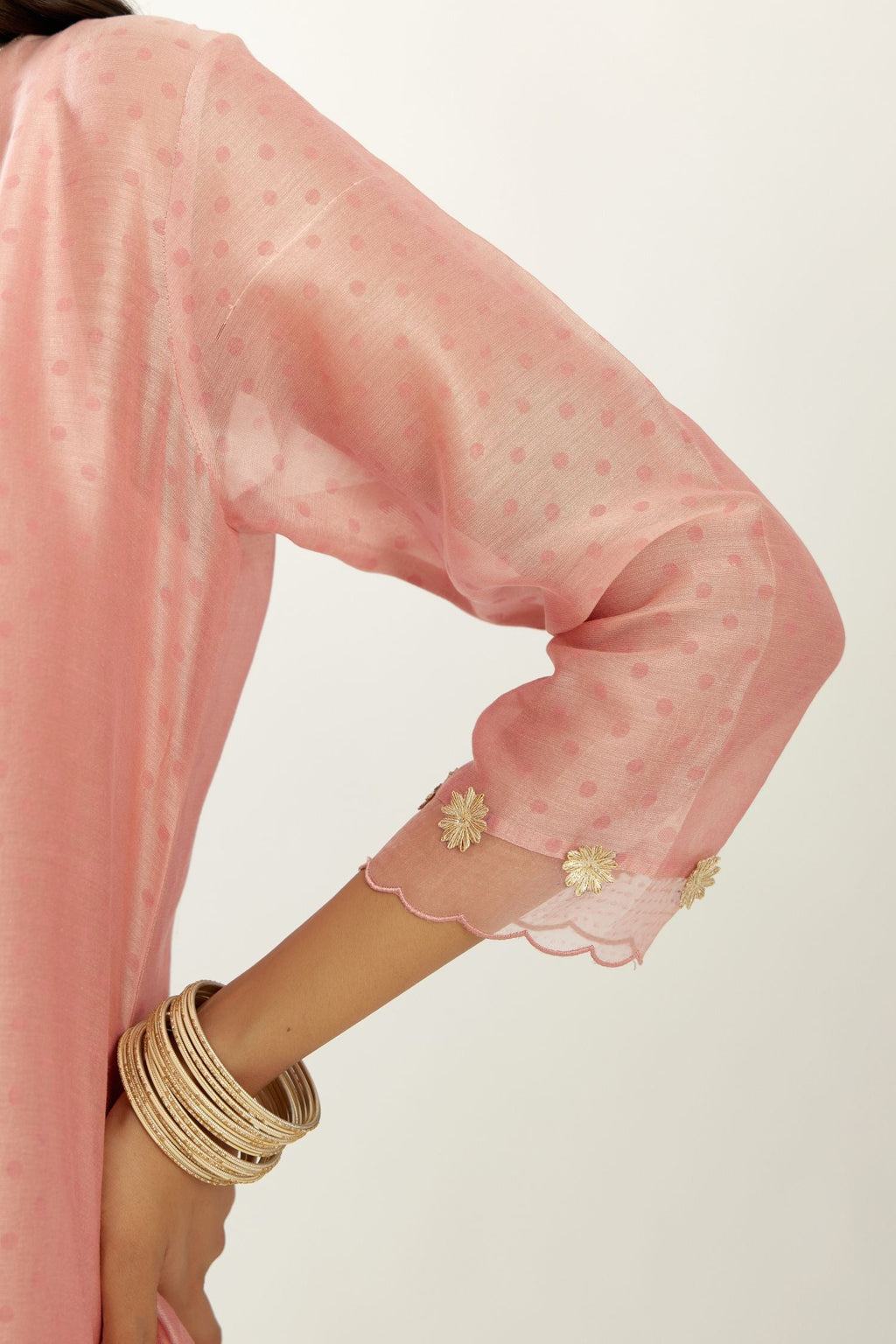 Pink silk chanderi hand block printed straight kurta set, highlighted with organza and gota embroidered flower at edges