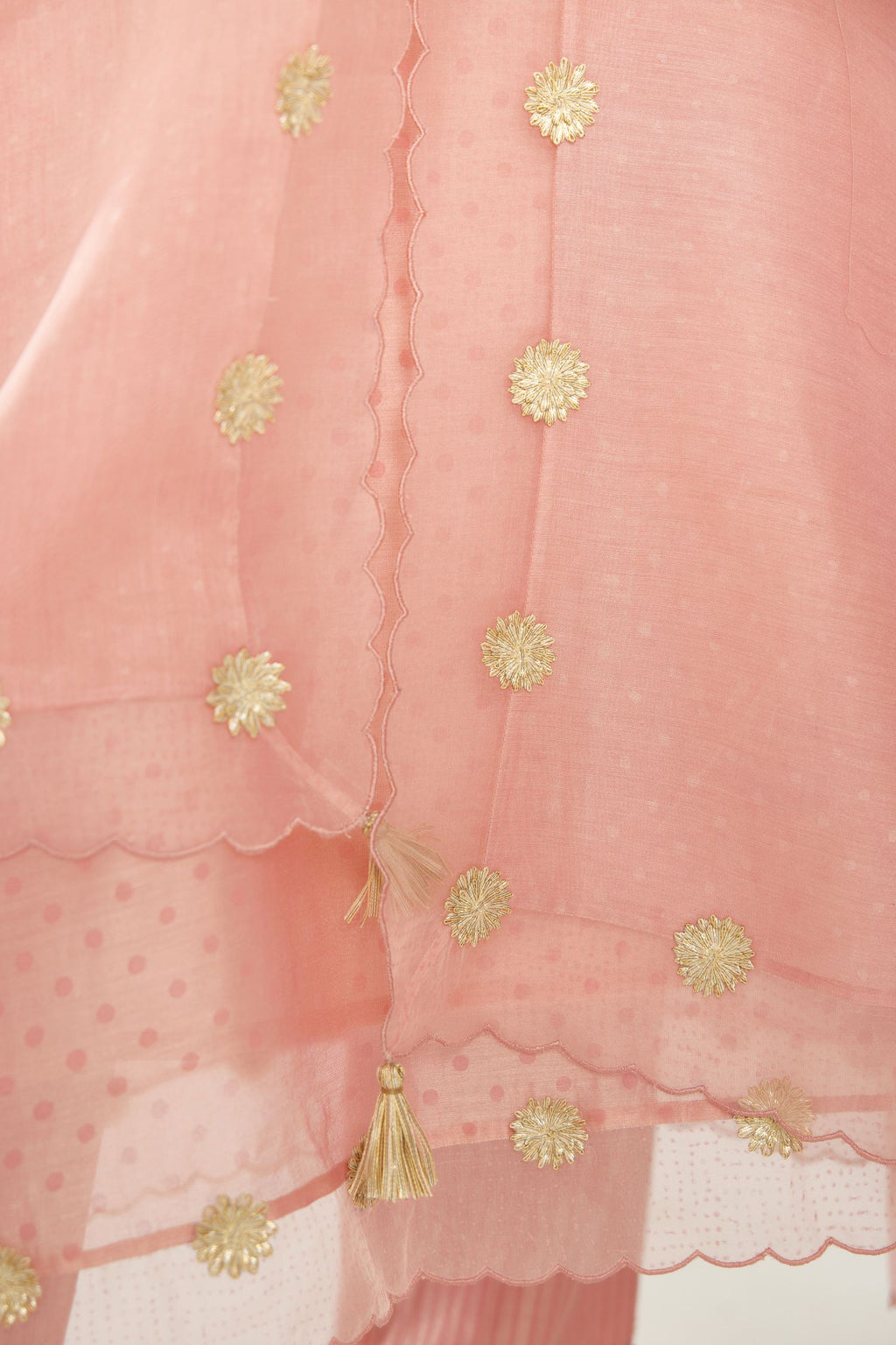 Pink hand block printed narrow dupatta, highlighted with all-over gota flower and organza scalloped edges.