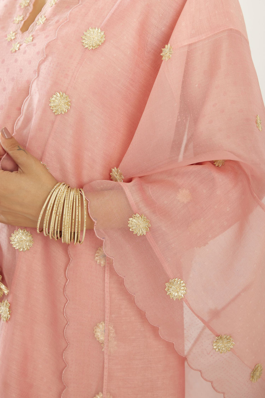 Pink hand block printed narrow dupatta, highlighted with all-over gota flower and organza scalloped edges.