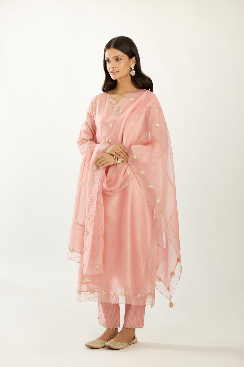 Pink hand block printed narrow dupatta, highlighted with all-over gota flower and organza scalloped edges.