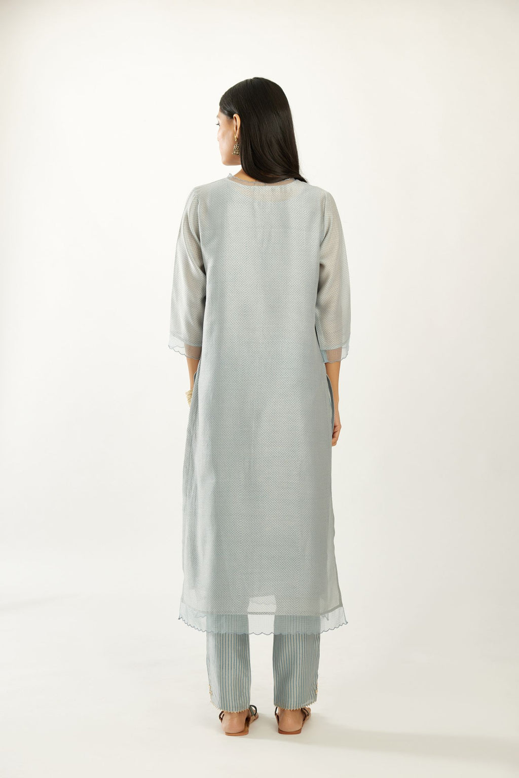 Blue silk chanderi hand block printed straight kurta set, highlighted with scalloped organza at edges.