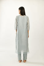 Blue silk chanderi hand block printed straight kurta set, highlighted with scalloped organza at edges.
