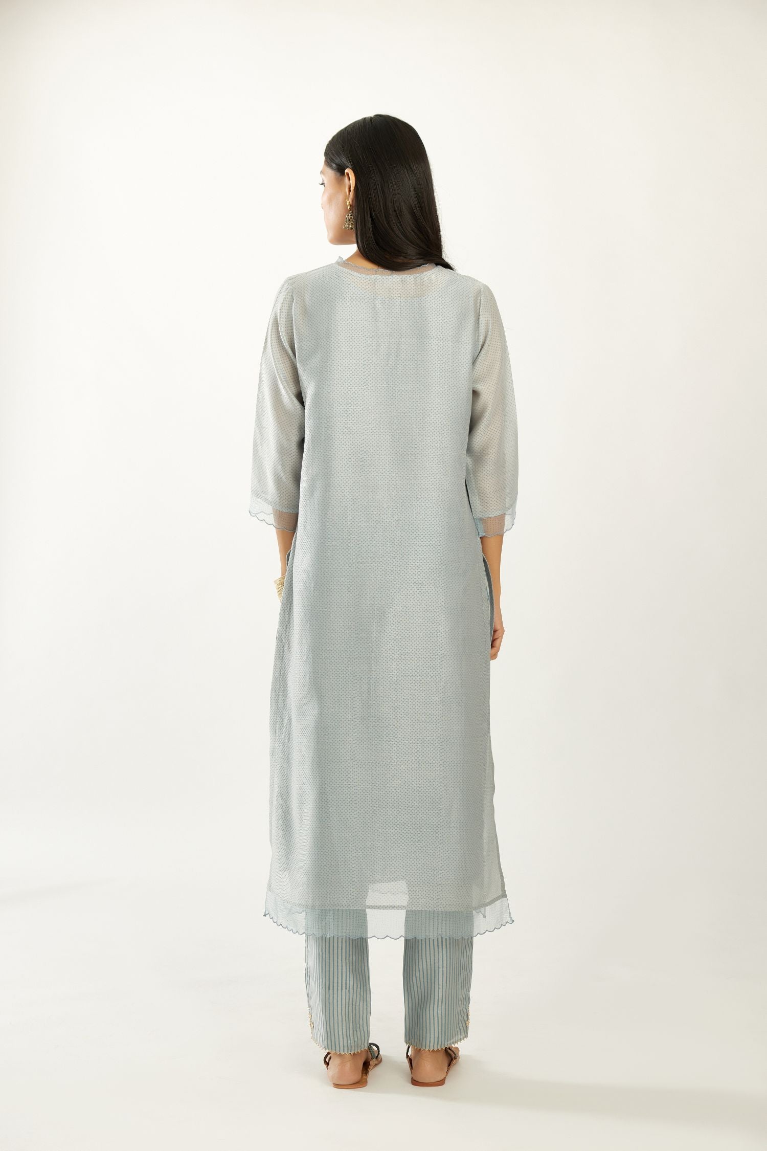 Blue silk chanderi hand block printed straight kurta set, highlighted with scalloped organza at edges.