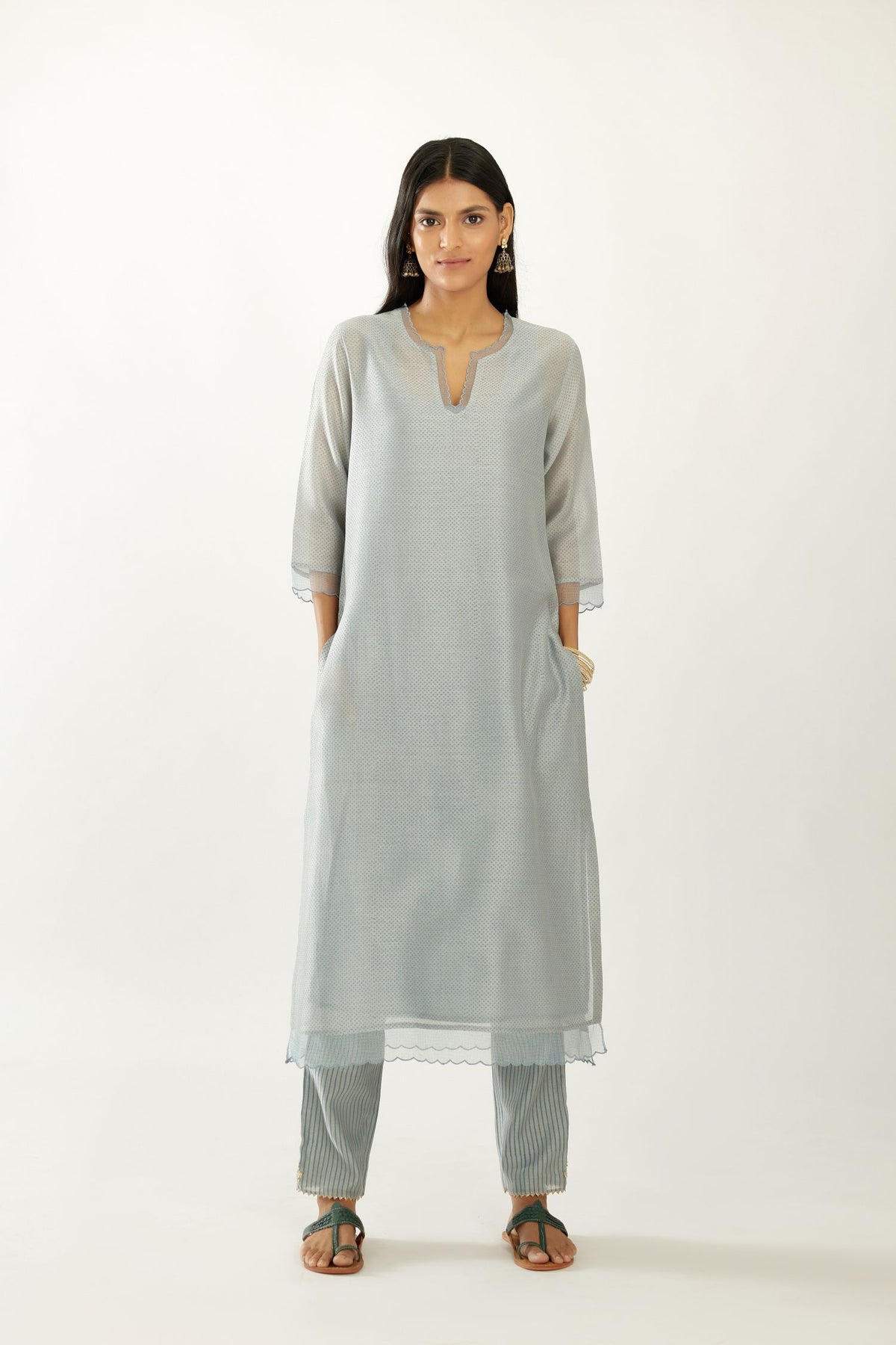 Blue silk chanderi hand block printed straight kurta set, highlighted with scalloped organza at edges.