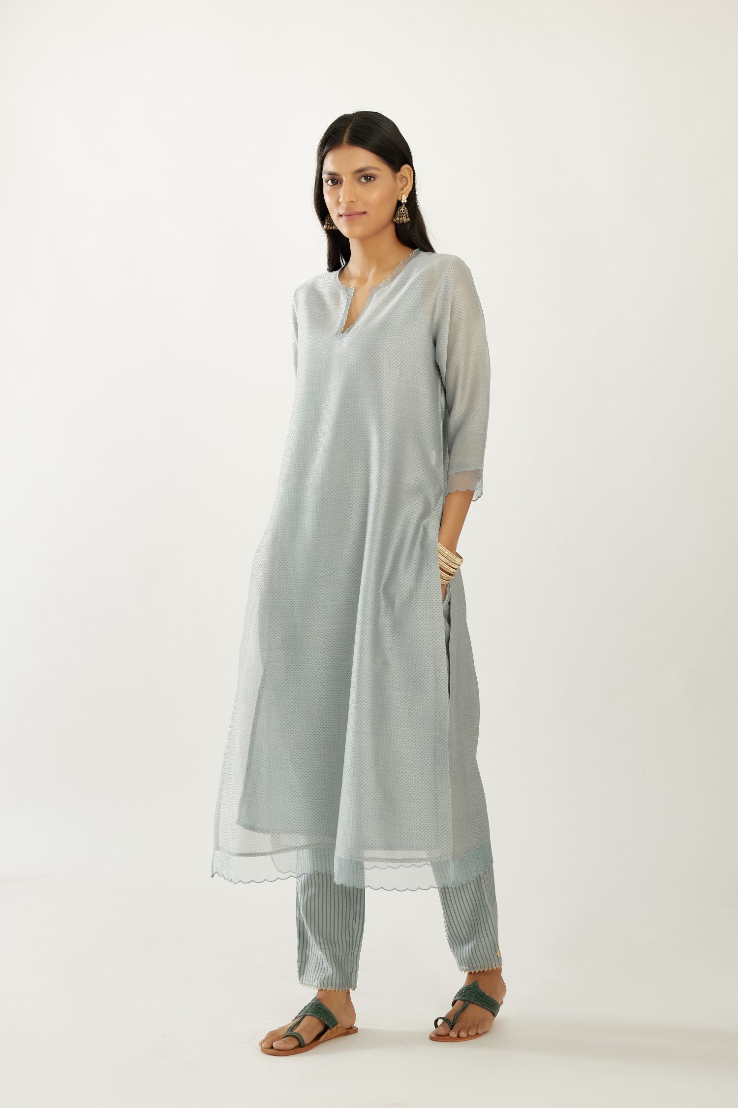 Blue silk chanderi hand block printed straight kurta set, highlighted with scalloped organza at edges.