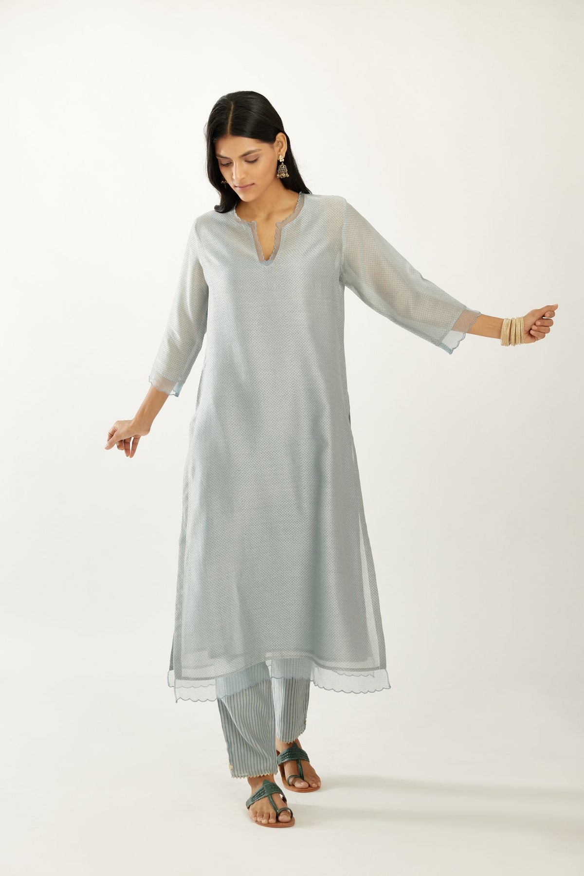 Blue silk chanderi hand block printed straight kurta set, highlighted with scalloped organza at edges.