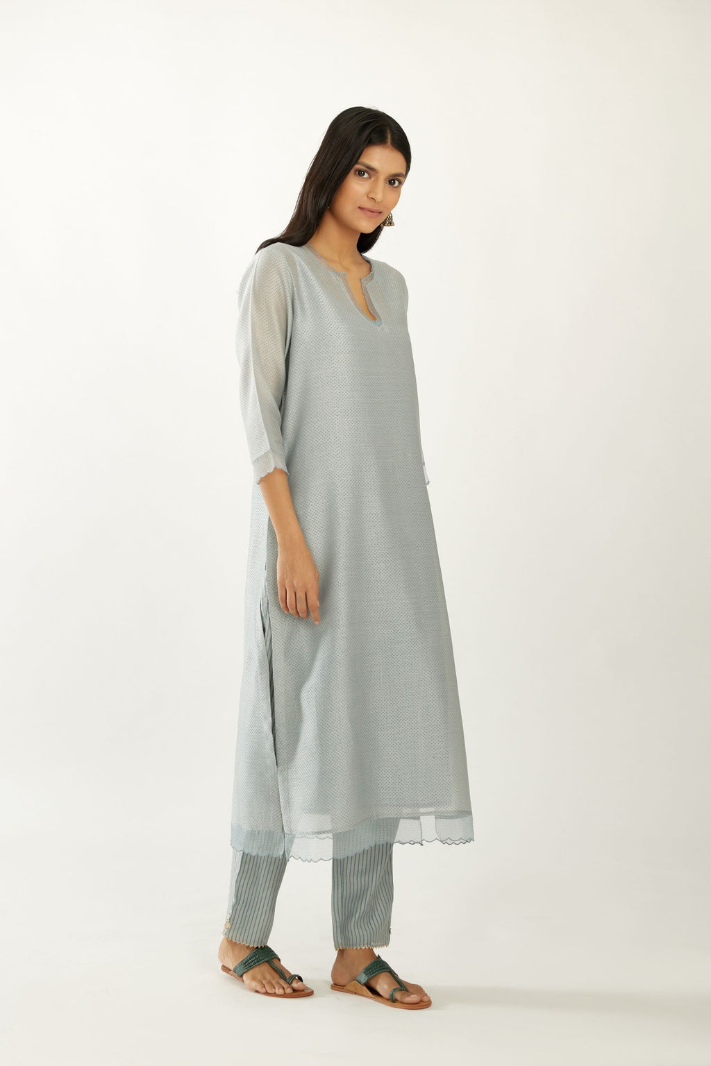 Blue silk chanderi hand block printed straight kurta set, highlighted with scalloped organza at edges.
