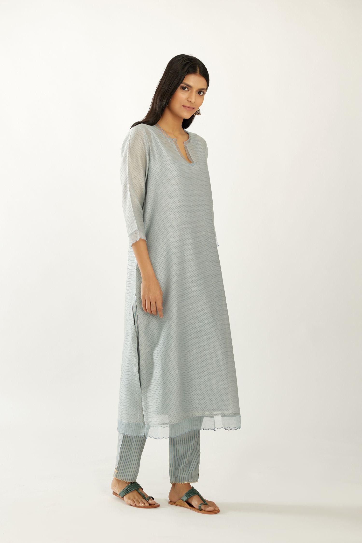 Blue silk chanderi hand block printed straight kurta set, highlighted with scalloped organza at edges.