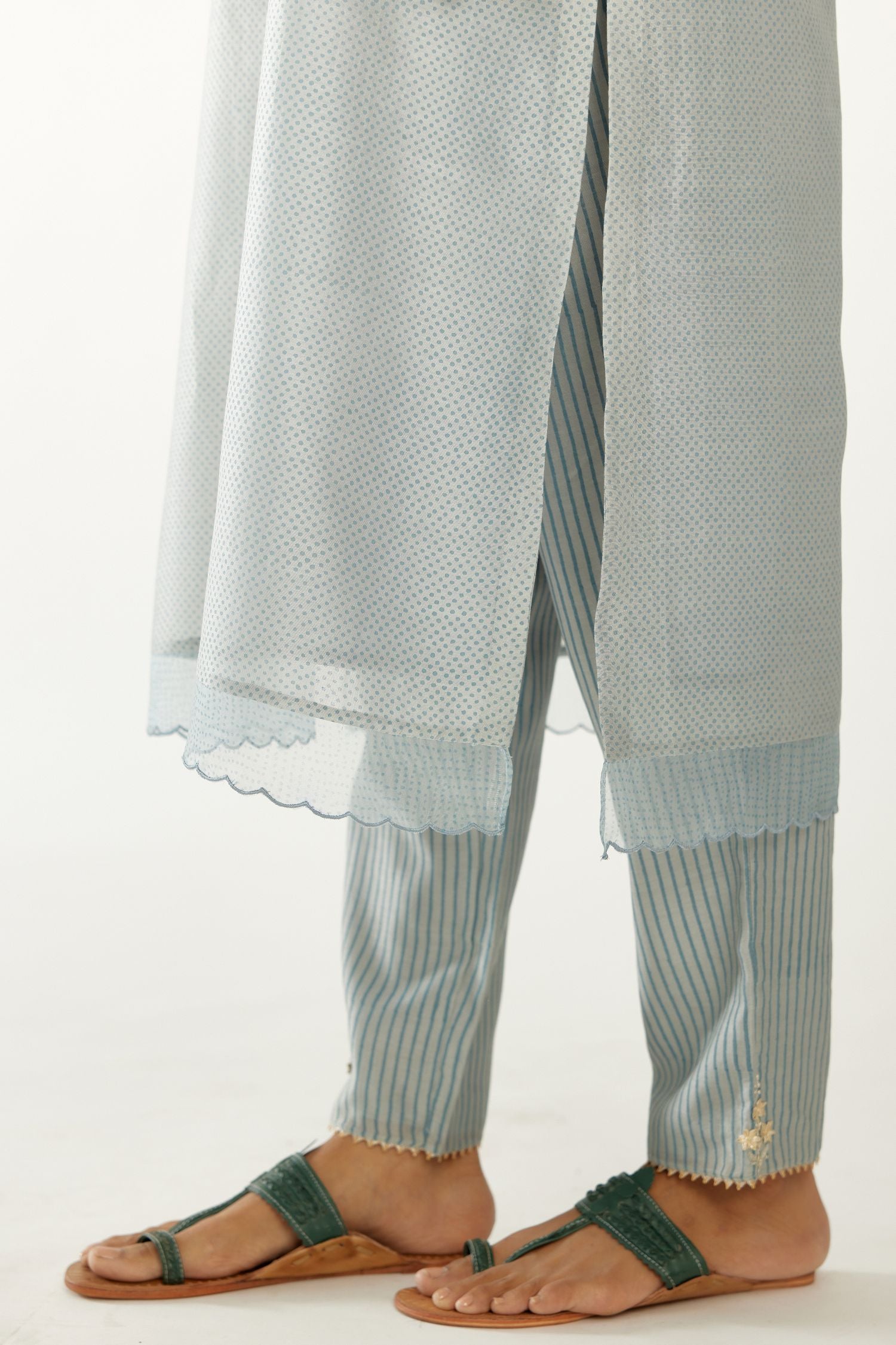 Blue silk chanderi hand block printed straight kurta set, highlighted with scalloped organza at edges.