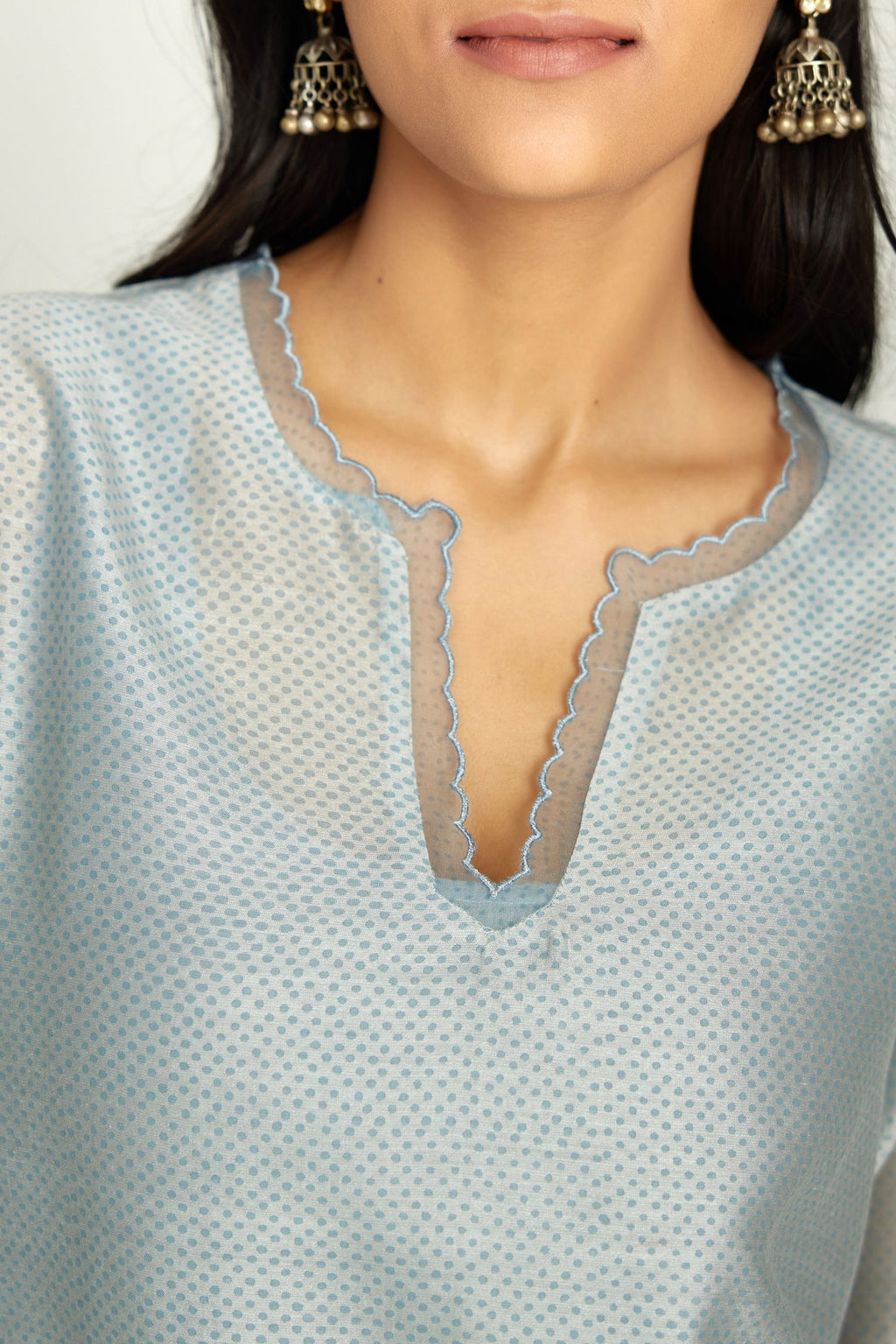 Blue silk chanderi hand block printed straight kurta set, highlighted with scalloped organza at edges.