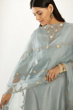 Blue silk chanderi hand block printed straight kurta set, highlighted with scalloped organza at edges.
