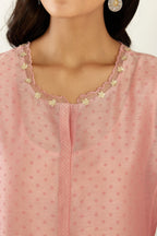 Pink hand block printed silk chanderi kurta set with concealed button placket neckline, Highlighted with gota flower and scalloped organza at edges.