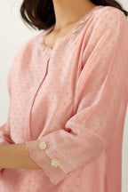 Pink hand block printed silk chanderi kurta set with concealed button placket neckline, Highlighted with gota flower and scalloped organza at edges.