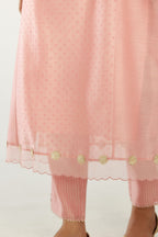Pink hand block printed silk chanderi kurta set with concealed button placket neckline, Highlighted with gota flower and scalloped organza at edges.