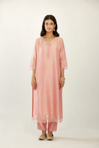 Pink hand block printed silk chanderi kurta set with concealed button placket neckline, Highlighted with gota flower and scalloped organza at edges.