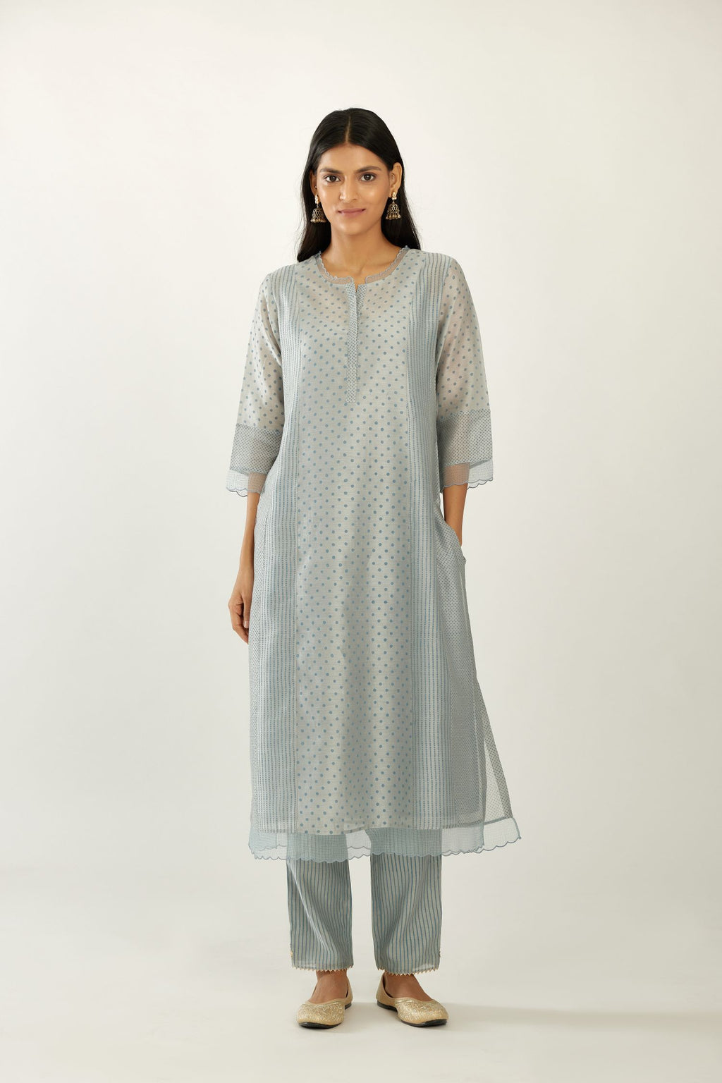 Blue silk chanderi hand block printed straight kurta set with concealed button placket neckline, highlighted with scalloped organza at edges.