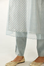 Blue silk chanderi hand block printed straight kurta set with concealed button placket neckline, highlighted with scalloped organza at edges.