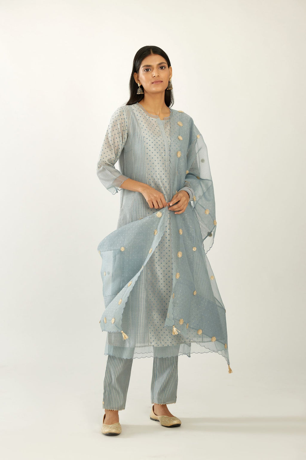 Blue silk chanderi hand block printed straight kurta set with concealed button placket neckline, highlighted with scalloped organza at edges.