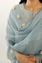 Blue silk chanderi hand block printed straight kurta set with concealed button placket neckline, highlighted with scalloped organza at edges.
