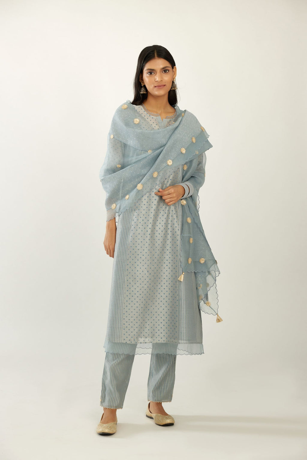 Blue silk chanderi hand block printed straight kurta set with concealed button placket neckline, highlighted with scalloped organza at edges.