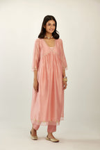 Pink hand block printed V neck gathered kurta set, highlighted with gota flower embroidery and scalloped organza at edges.